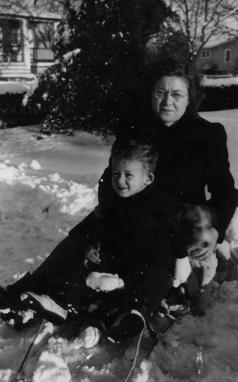 Virginia DeSantis sledding with a grandchild circa 1935. Notice the dog on the sled to the right.